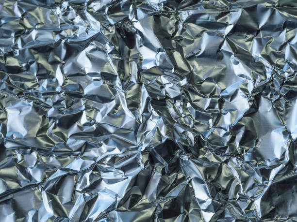 istock close up crumpled aluminium tinfoil silver background 1417300677