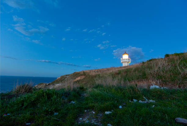 istock Karaburun lighthouse and wavy harbor photographed using long exposure technique 1417301290