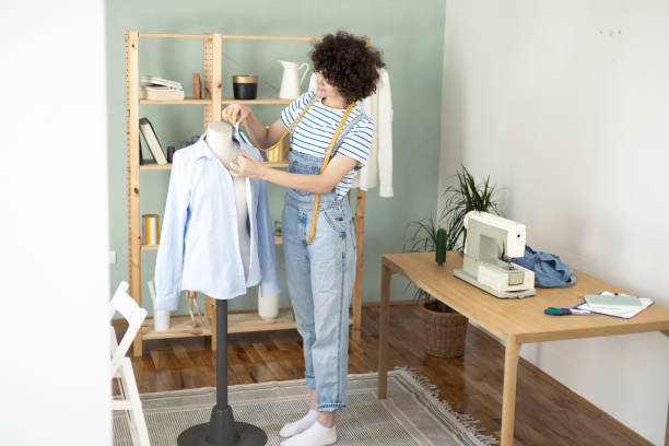istock Young female tailor making clothes at her sewing studio 1417302520