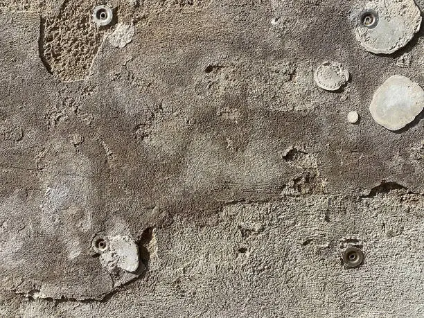 Closeup of cement wall with circles white texture.