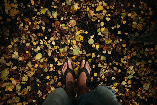 A hiker admiring the view of an autumn natural landscape after a walk in the mountains