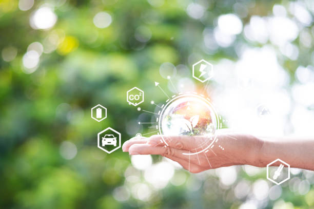 istock Hands protecting globe against nature with icons green energy sources for renewable, Ecology and Environment concept. 1417308657
