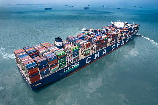 A CMA-CGM, LNG-powered large container ship leaves Shanghai Yangshan Deep-Water Port loaded with cargo containers