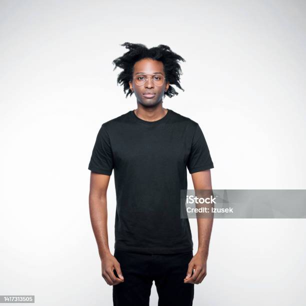 Portrait Of Handsome Man In Black Outfit Stock Photo - Download Image Now - T-Shirt, Cool Attitude, Black Color