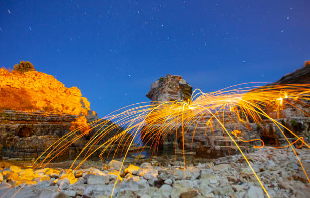 istock Night star exposure and steel wool shot , Kerpe devil cliffs , Kocaeli 1417317956