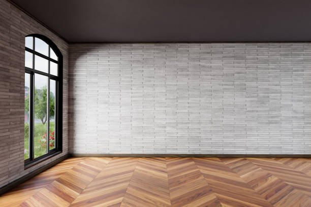 istock modern light-flooded empty room, white brick wall and wooden herringbone parquet floor; large window with idyllic lakeside view; 3D illustration 1417319737