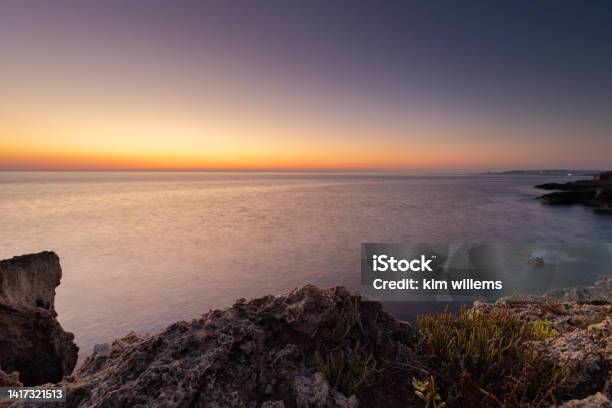 Amazing Sunrise Over The Rising Cliffs And Rocks In Malta With Spectacular Colors In The Sky And Reflections Of The Sun In Het Mediterranean Sea Stock Photo - Download Image Now