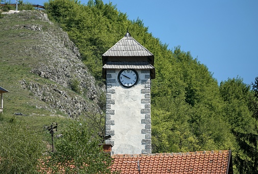 Donji Vakuf, Bosnia and Herzegovina – May 2022: Sahat Kula / clock tower of Donji Vakuf. Inscripted as national monument (18th century)