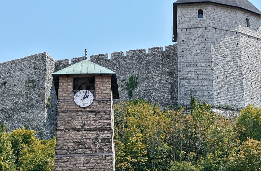Tešanj, Bosnia and Herzegovina – May 2022: Sahat Kula / clock tower of Tešanj. Inscripted as a national monument.