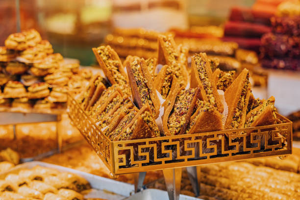 istock Various Turkish delights sweets and traditional authentic helva candy with nuts for sale at market showcase. Tasty shop business concept 1417323628