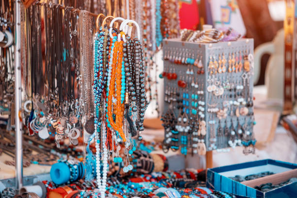 costume jewelry and beads and bracelets at the flea market are for sale. - necklace jewelry bead homemade imagens e fotografias de stock