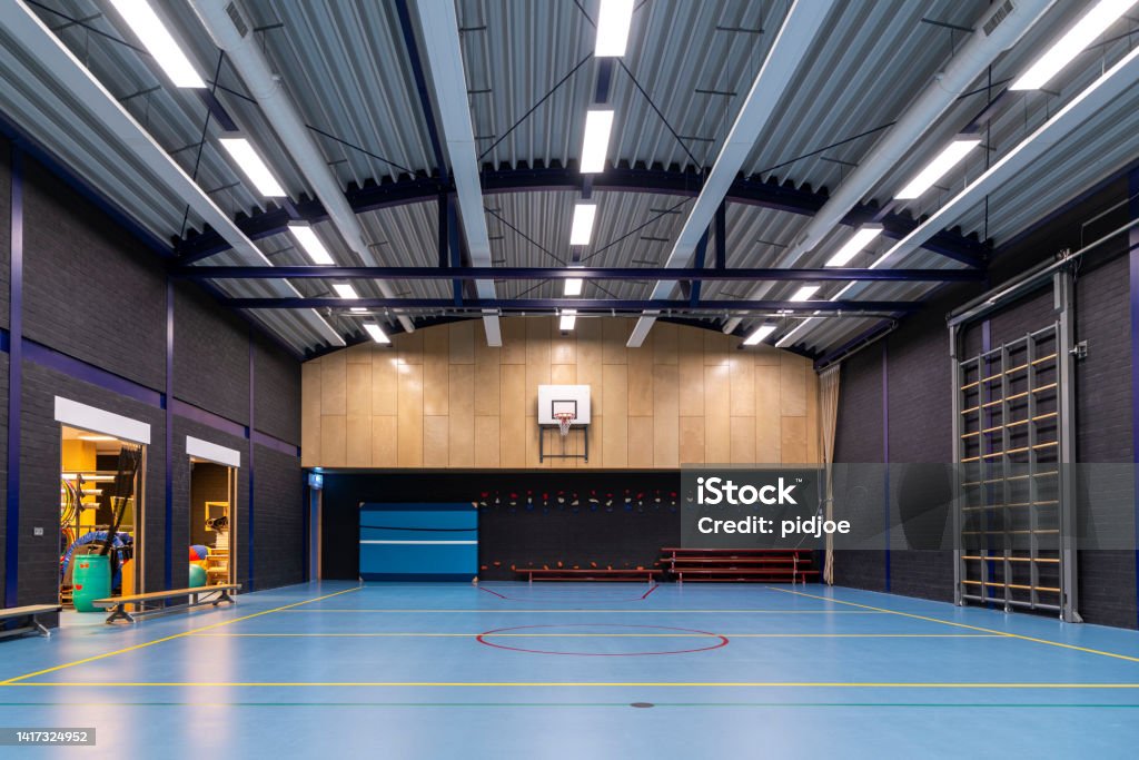 School GYM An empty school gymnasium, low angle view. Sports Court Stock Photo
