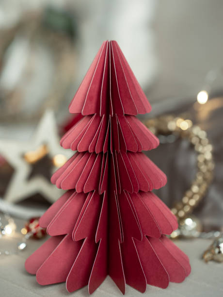istock Close-up of a decorative cardboard Christmas tree on a blurred background. 1417326908
