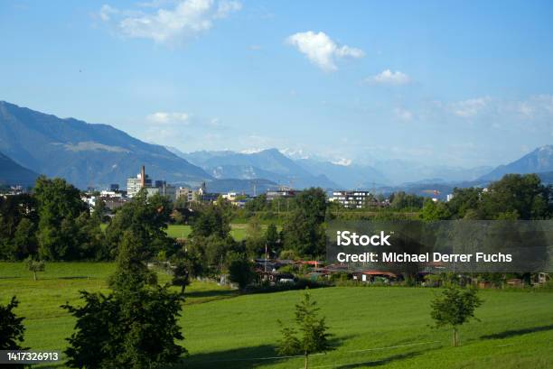 Titel Skyline Of City Of Baar And Zug With Swiss Alps In The Background On A Sunny Summer Day Stock Photo - Download Image Now