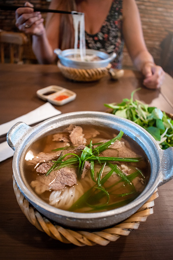 Typical Vietnamese Pho Bo soup. Vietnamese food. Delicious Vietnamese dish Pho Bo. Noodle soup in Vietnam