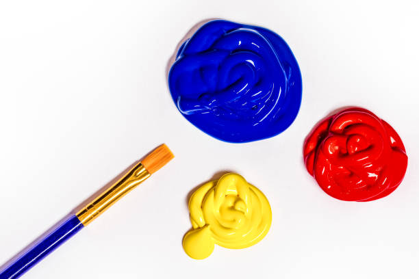 Red, blue and yellow acrylic paint on white paper with a paintbrush