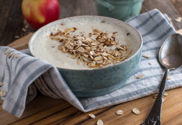 Apple yogurt with roasted oats for breakfast stock photo