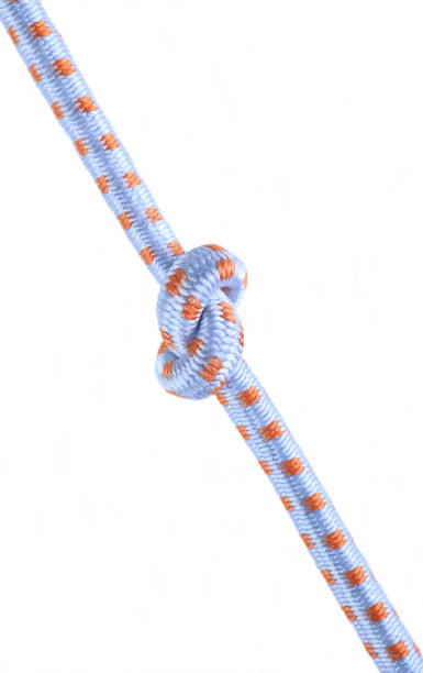 istock Colored ropes tied in a knot on a white background 1417334796