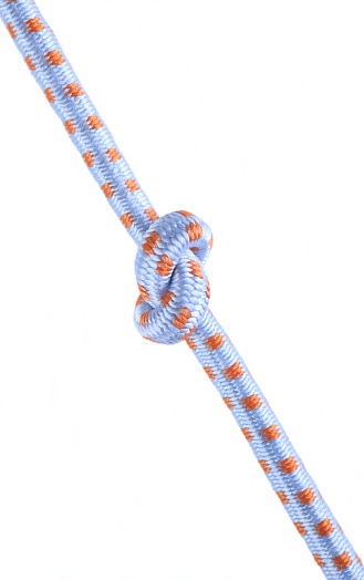 Colored ropes tied in a knot on a white background