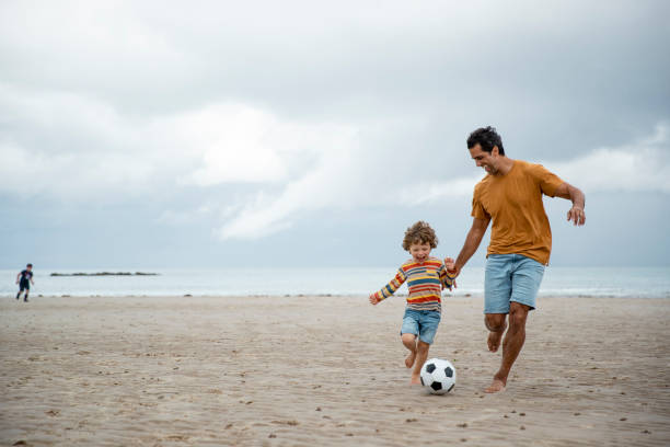 istock Beach Football with My Son 1417336808