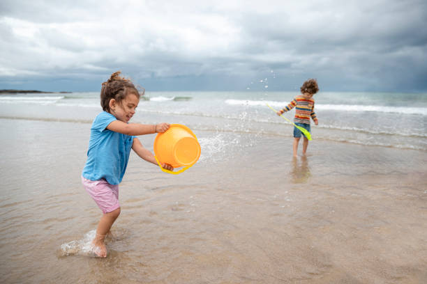 istock Brother and Sister at the Beach 1417337399