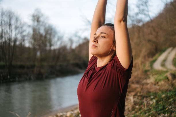 istock Young woman stretching after running 1417337530