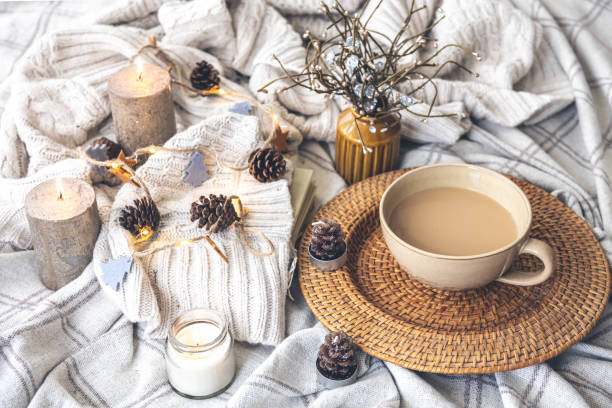 istock Cozy autumn composition with a big cup of coffee in bed. 1417339193