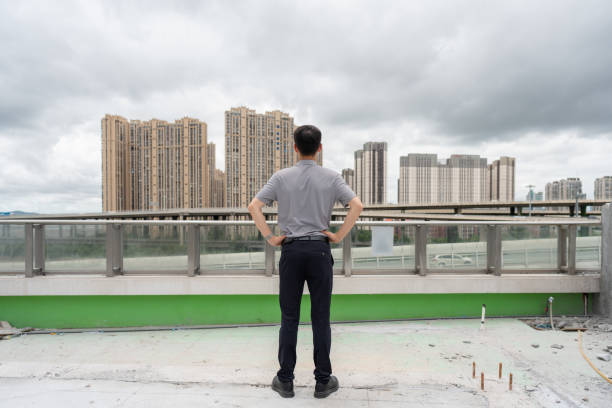 Back view of business man on construction site
