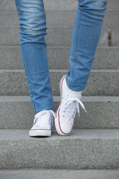 istock Women shoes with denim jeans 1417340153