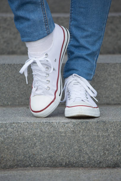 istock Women shoes with denim jeans 1417340235