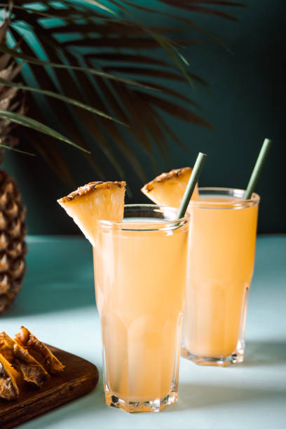 Summer refreshing tropical drink juice or cocktail with pineapple juice and tequila. stock photo