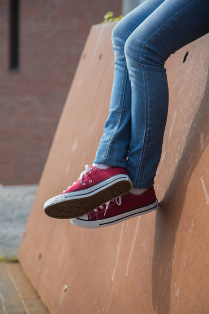 istock Women shoes with denim jeans 1417341944