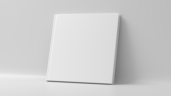 Blank square hardcover book cover mockup standing on white background
