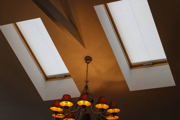 Pleated blinds on roof windows close up in the interior