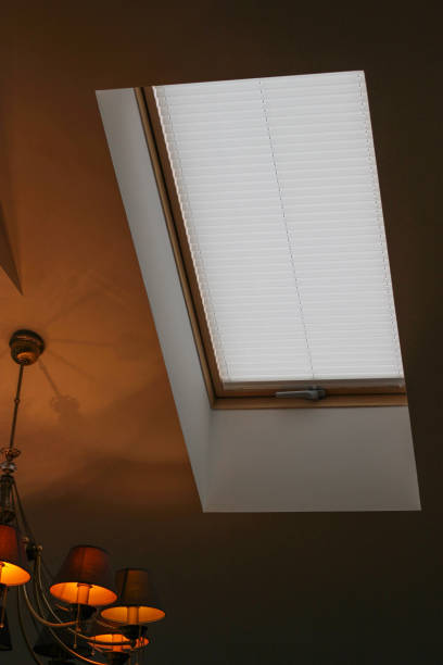 istock Pleated blinds on roof windows close up in the interior 1417347499