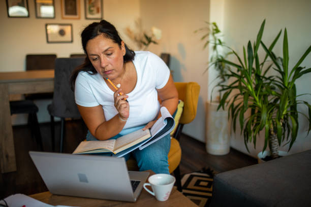 istock Adult woman learning at home 1417348702