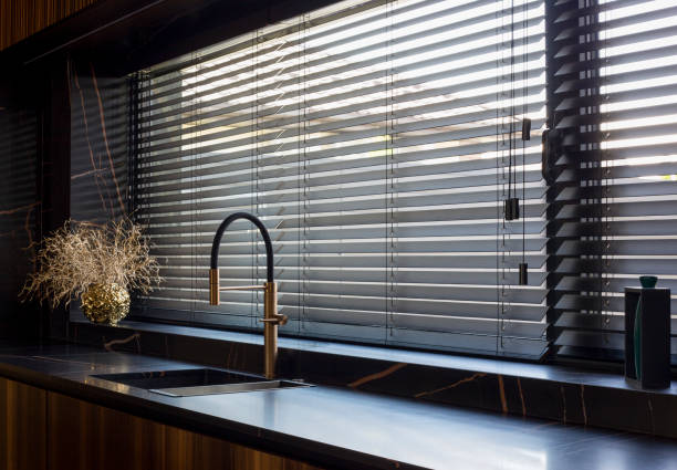 istock Wooden blinds black color closeup in the kitchen. 1417351177