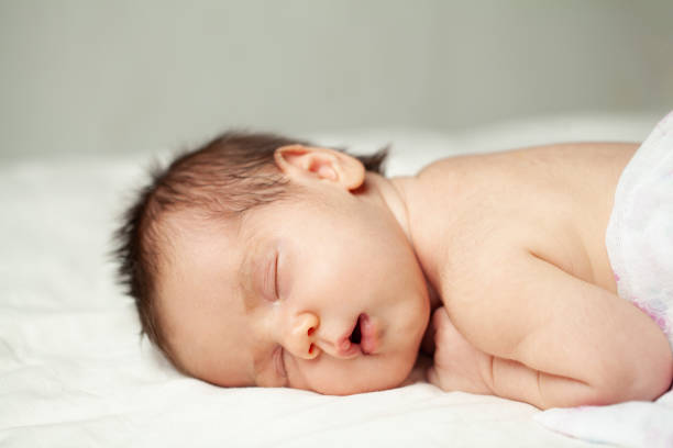 istock Sleeping newborn baby close up portrai 1417355304