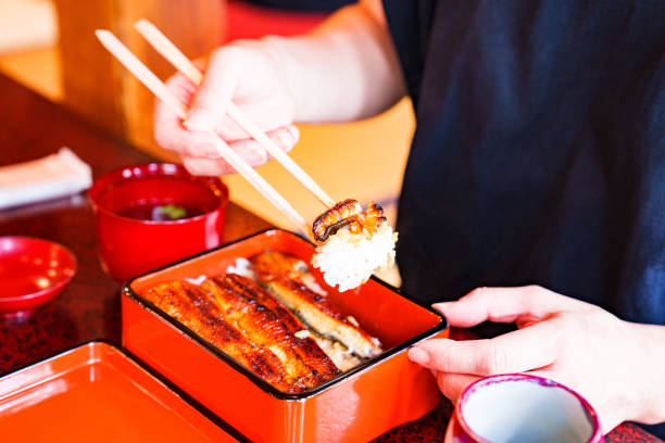 istock Japanese woman eat Unagi 1417359096