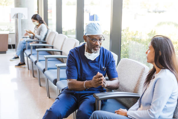 istock Nurse practitioner sits and talks to the female patient 1417359314