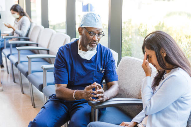 istock Female patient places her hands on her head in worry 1417359330