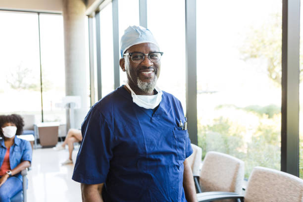 istock Handsome doctor smiles for the camera 1417359359