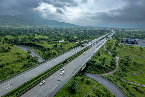 The Mumbai-Pune Expressway during the monsoon season near Pune India. The Expressway is officially called the Yashvantrao Chavan Expressway.