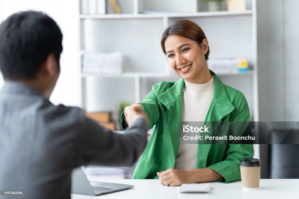 Business people shaking hands, finishing up meeting. business hand shake concept. Mentorship Stock Photo