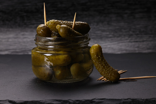 Pickled Gherkin with cocktail sticks. High resolution image 45Mp taken with Canon EOS R5 and associate macro lens