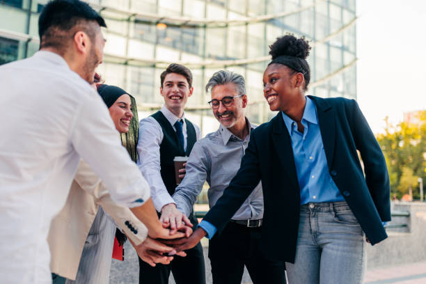 istock Business team in huddle outdoors 1417375339