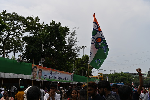 Kolkata, West Bengal, India - 21st July 2022 : All India Trinamool Congress Party, AITC or TMC, at Ekushe July, Shadid Dibas, Martyrs day rally. Colourful party flags waving over heads.