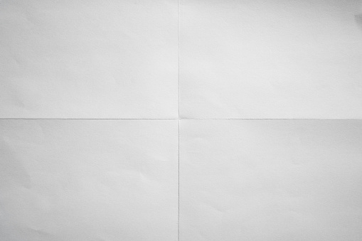 White paper crisp folded in four fraction background