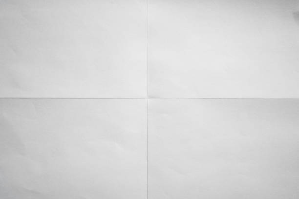 White paper crisp folded in four fraction background stock photo
