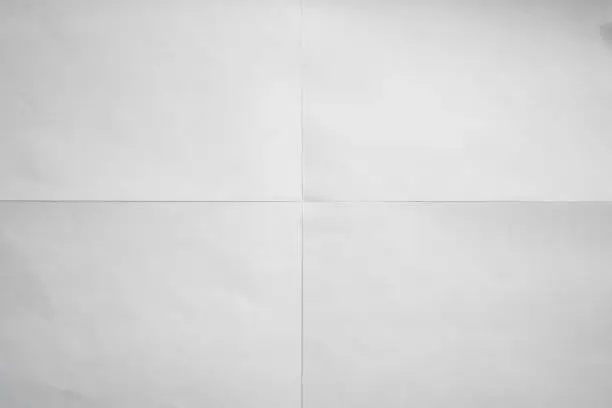 White paper crisp folded in four fraction background